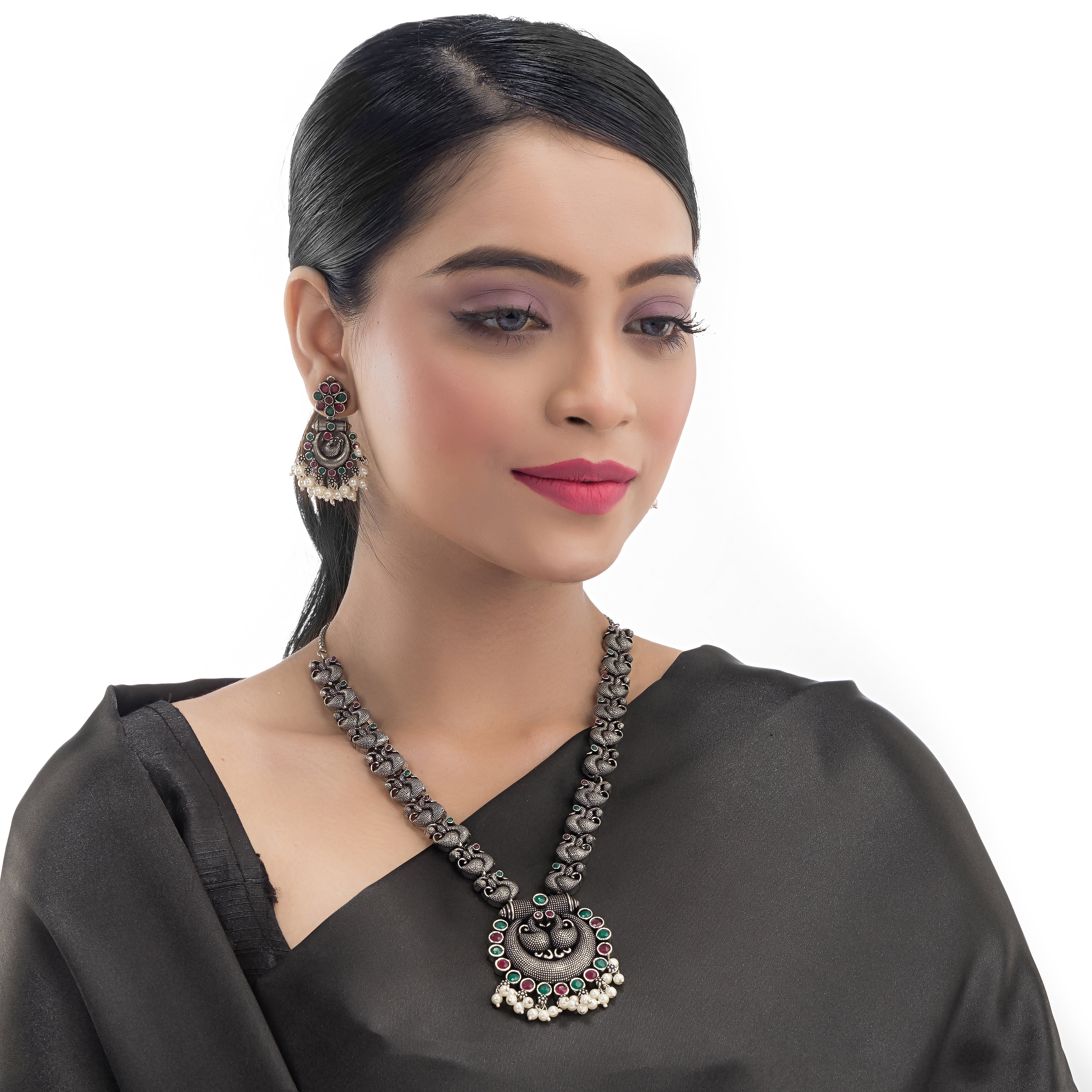 Intricate oxidized necklace set with a beautiful peacock design for a festive look.
