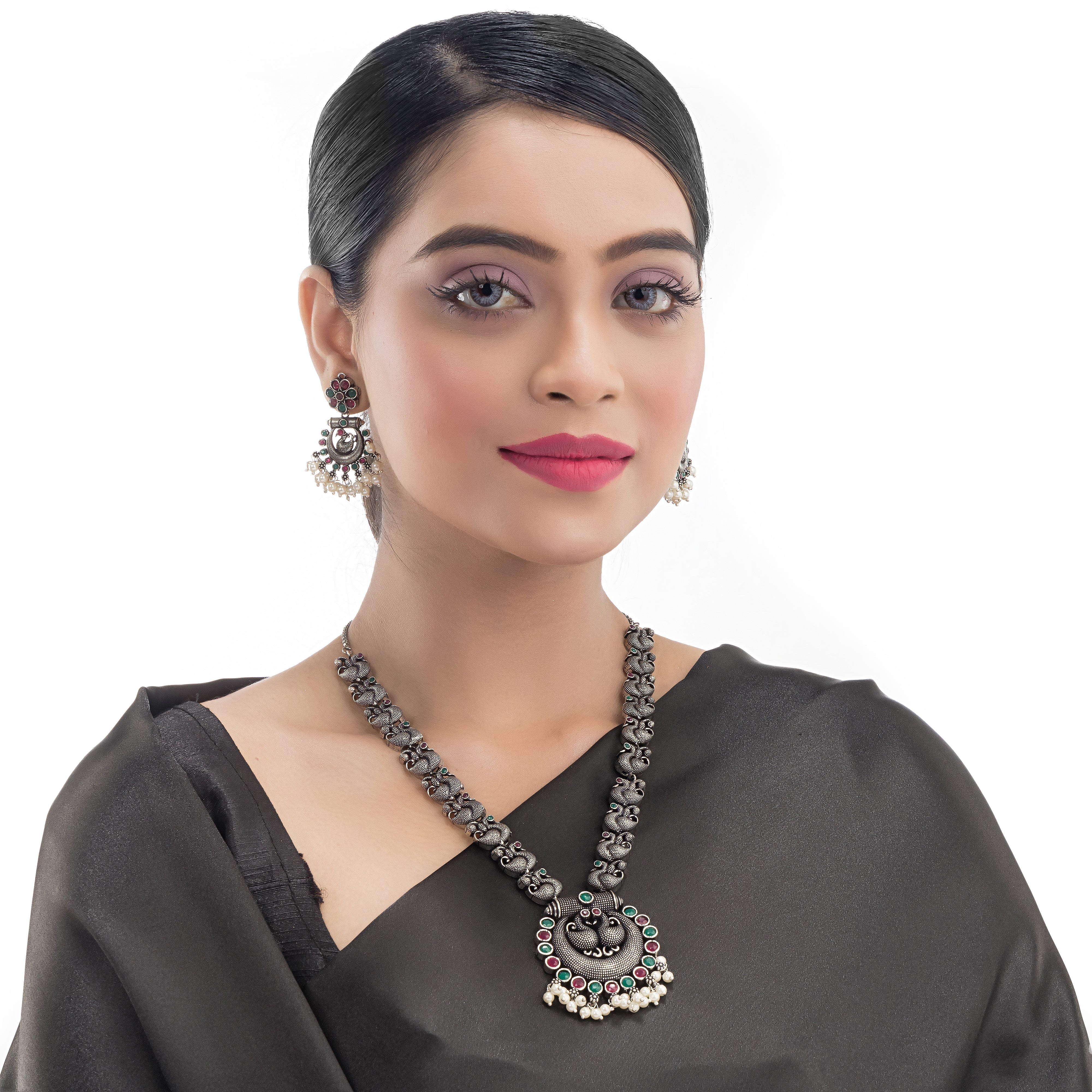 Intricate oxidized necklace set with a beautiful peacock design for a festive look.
