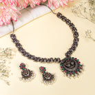 Intricate oxidized necklace set with a beautiful peacock design for a festive look.
