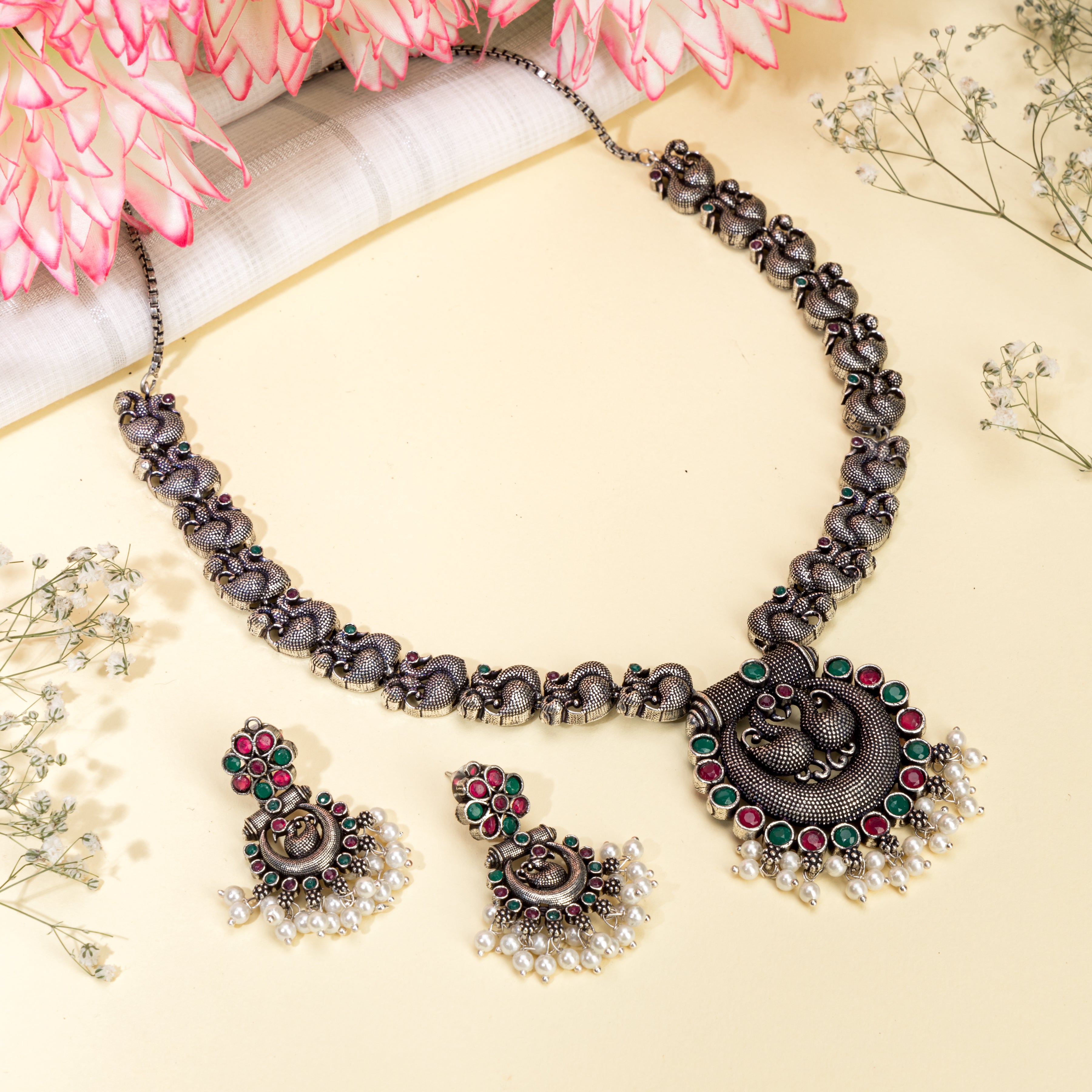 Intricate oxidized necklace set with a beautiful peacock design for a festive look.
