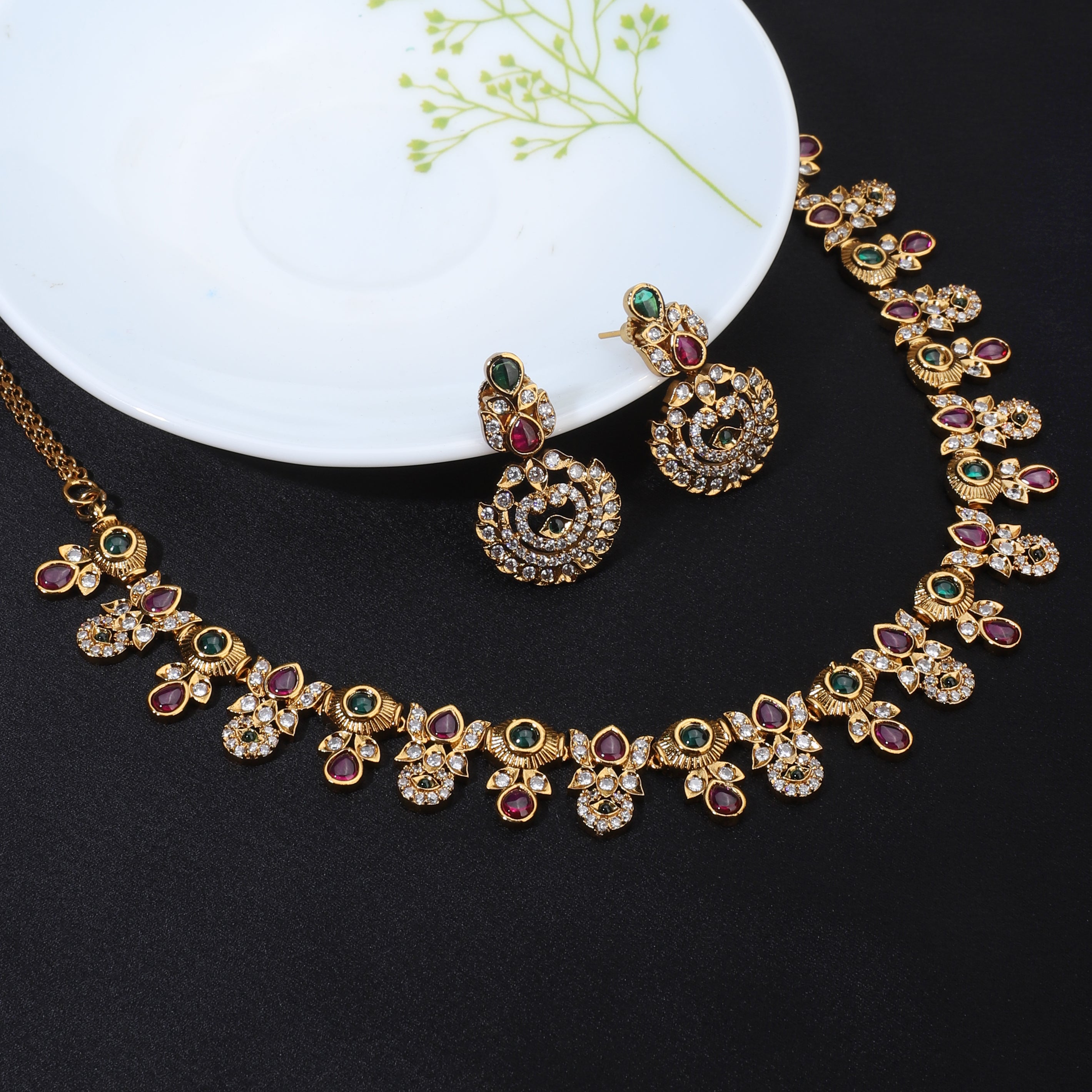 Gold-tone short necklace set with vibrant multicolor stones and matching earrings, perfect for celebrations.
