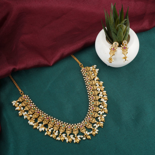"Gold-tone short necklace set with multicolor stones and zircon accents for a festive look."
