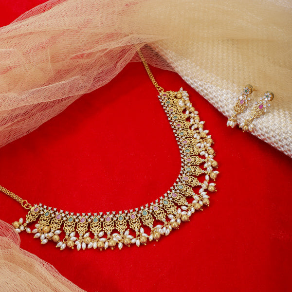 "Gold-tone short necklace set with multicolor stones and zircon accents for a festive look."
