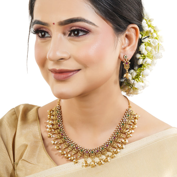"Gold-tone short necklace set with multicolor stones and zircon accents for a festive look."
