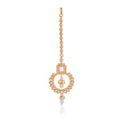 "Kundan-studded earrings with matching maang tika, a timeless set for a classic festive look."
