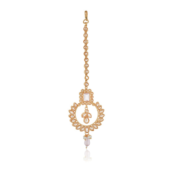 "Kundan-studded earrings with matching maang tika, a timeless set for a classic festive look."

