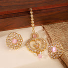 "Kundan-studded earrings with matching maang tika, a timeless set for a classic festive look."
