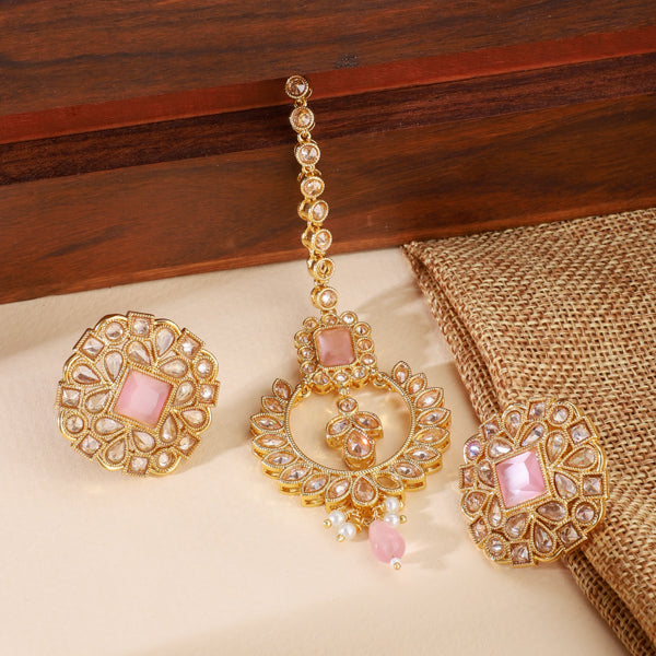 "Kundan-studded earrings with matching maang tika, a timeless set for a classic festive look."
