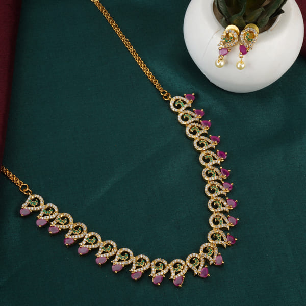 Vibrant multicolor stone-studded goldtone necklace set with matching earrings for festive elegance.
