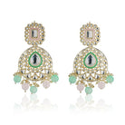 "Festive Kundan and multicolor pearl earrings with matching Maang Tikka, offering an elegant look."
