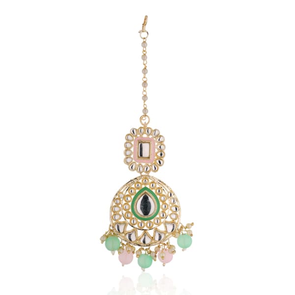 "Festive Kundan and multicolor pearl earrings with matching Maang Tikka, offering an elegant look."
