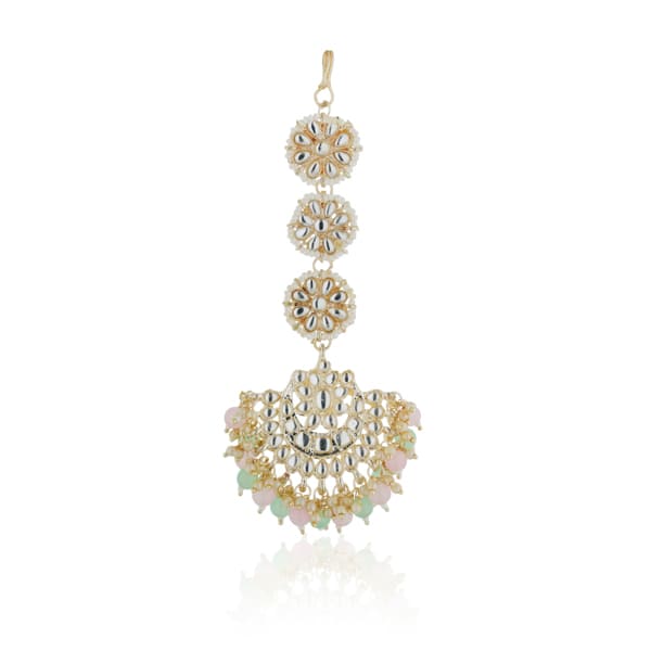 "Multicolor Kundan and pearl earrings with Maang Tikka, perfect for a classic festive style."
