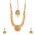 "Goldtone Laxmi Maa crafted long necklace set with matching earrings and Maang Tikka for festive elegance."
