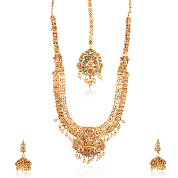 "Goldtone Laxmi Maa crafted long necklace set with matching earrings and Maang Tikka for festive elegance."
