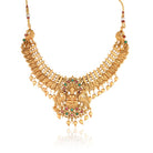 "Goldtone Laxmi Maa crafted long necklace set with matching earrings and Maang Tikka for festive elegance."
