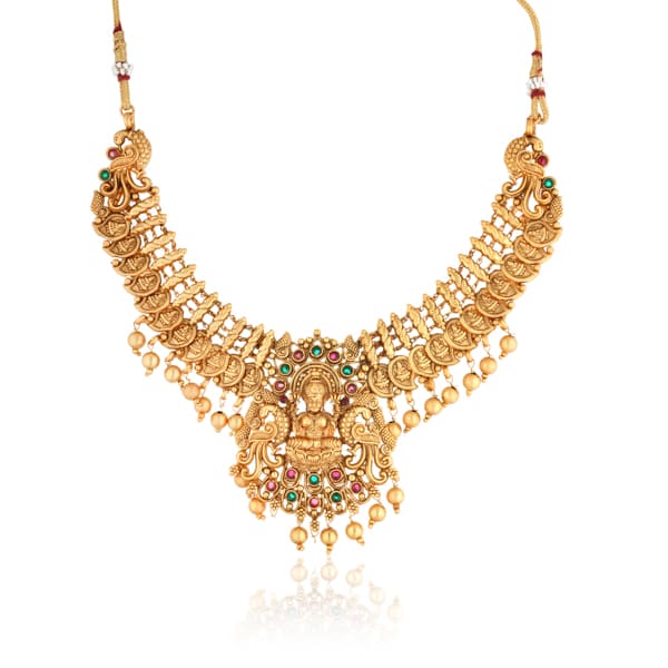 "Goldtone Laxmi Maa crafted long necklace set with matching earrings and Maang Tikka for festive elegance."

