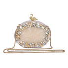 Oval-shaped salmon resin clutch with peacock design closure and sleek sling chain for style.
