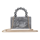 Grey resin clutch with velvet lining, heavy-duty sling, and extra pocket for convenient storage.
