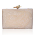 Resin clutch with captivating green agate stone, paired with a stylish sling chain for elegance.
