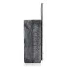 Exclusive grey resin clutch with flower handles, heavy sling, and extra pocket for practicality.
