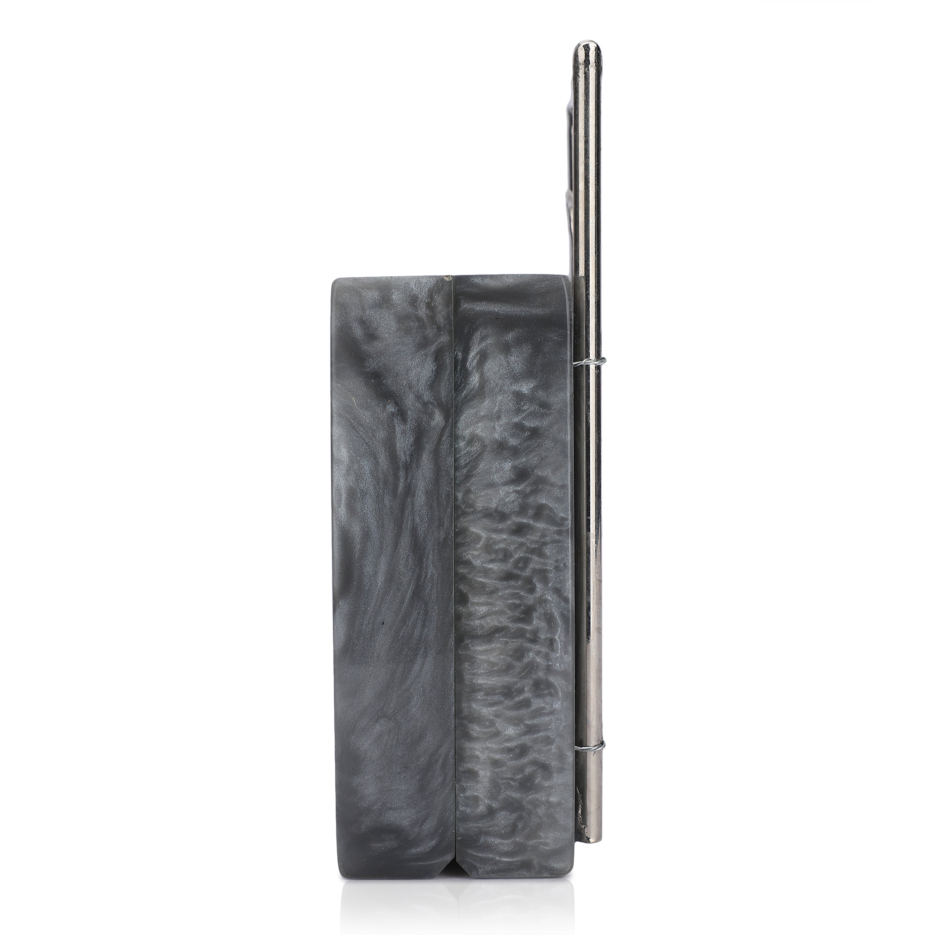 Exclusive grey resin clutch with flower handles, heavy sling, and extra pocket for practicality.
