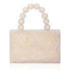 Salmon resin clutch with velvet lining, heavy-duty sling, and extra pocket for convenient storage.
